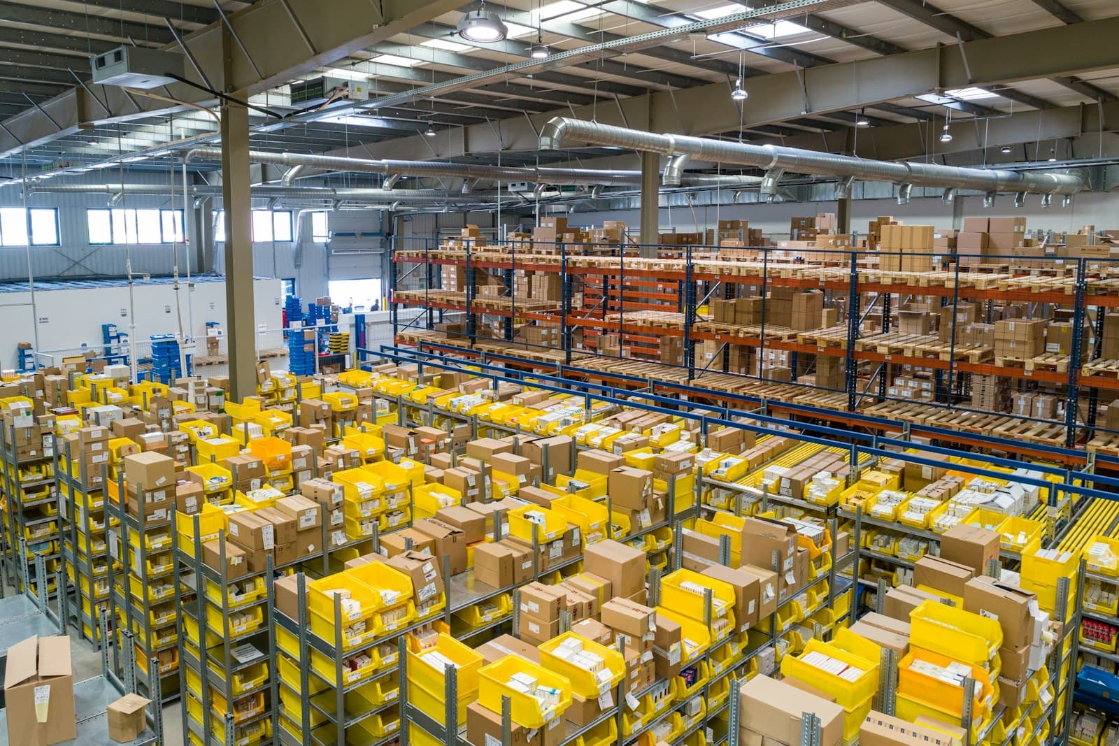 Shelves and packing stations in a distribution warehouse